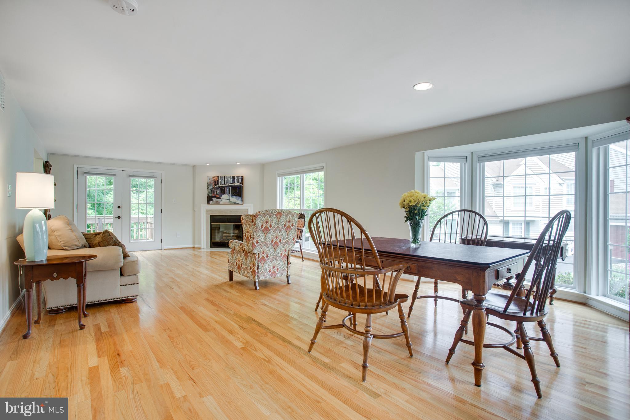 1511 Deer Point Way Reston, VA 20194 - Photo 11 of 30 a view of a dining room with furniture and wooden floor