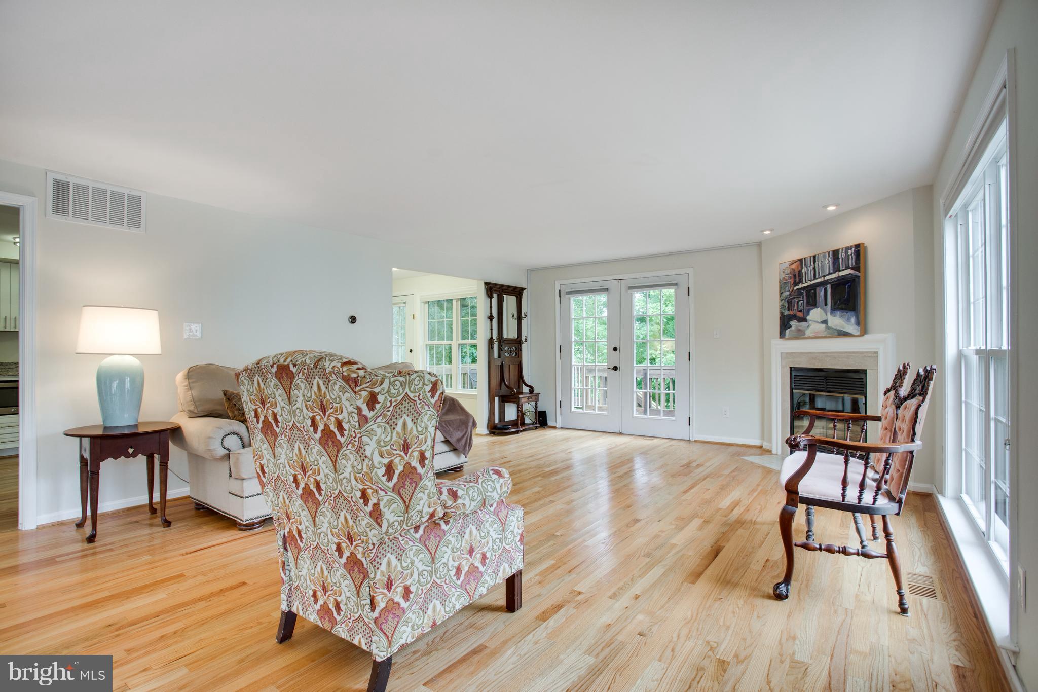 1511 Deer Point Way Reston, VA 20194 - Photo 12 of 30 a living room with furniture and a fireplace