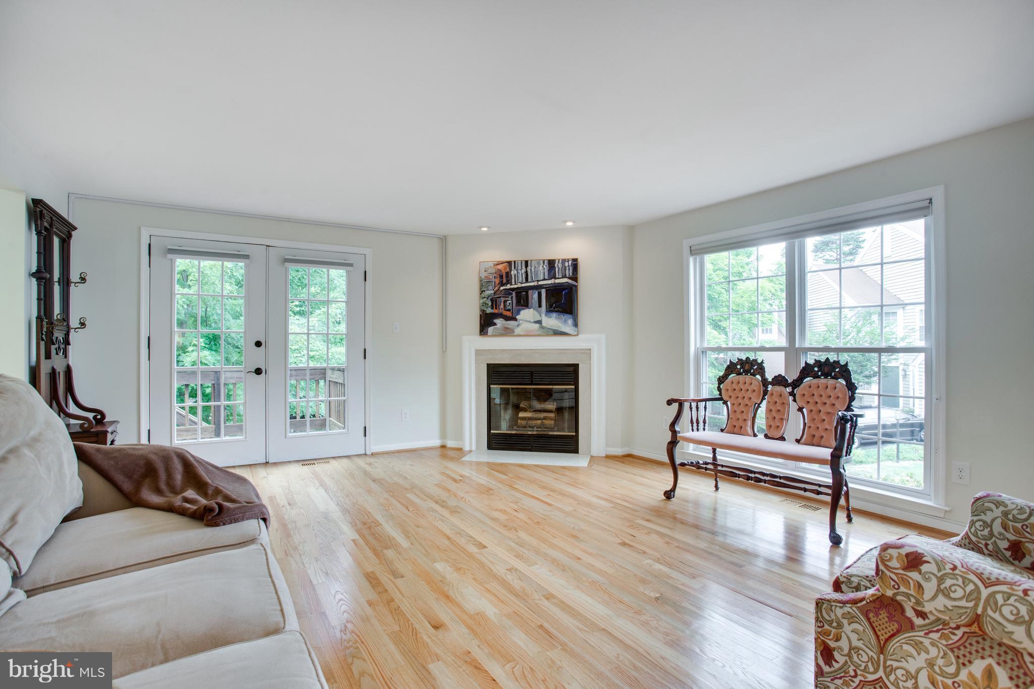 1511 Deer Point Way Reston, VA 20194 - Photo 13 of 30 a living room with furniture and a fireplace