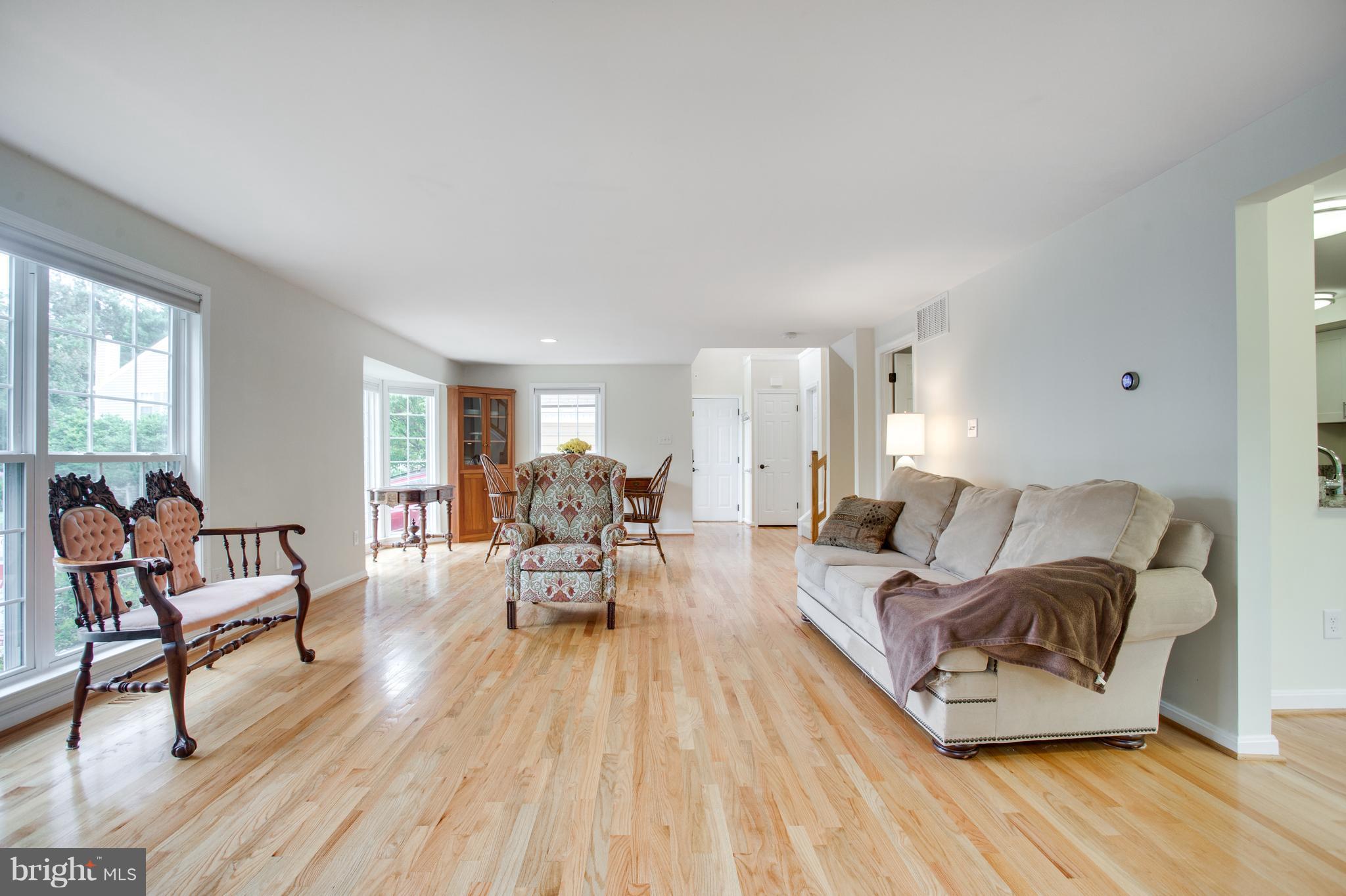 1511 Deer Point Way Reston, VA 20194 - Photo 15 of 30 a living room with furniture and a wooden floor