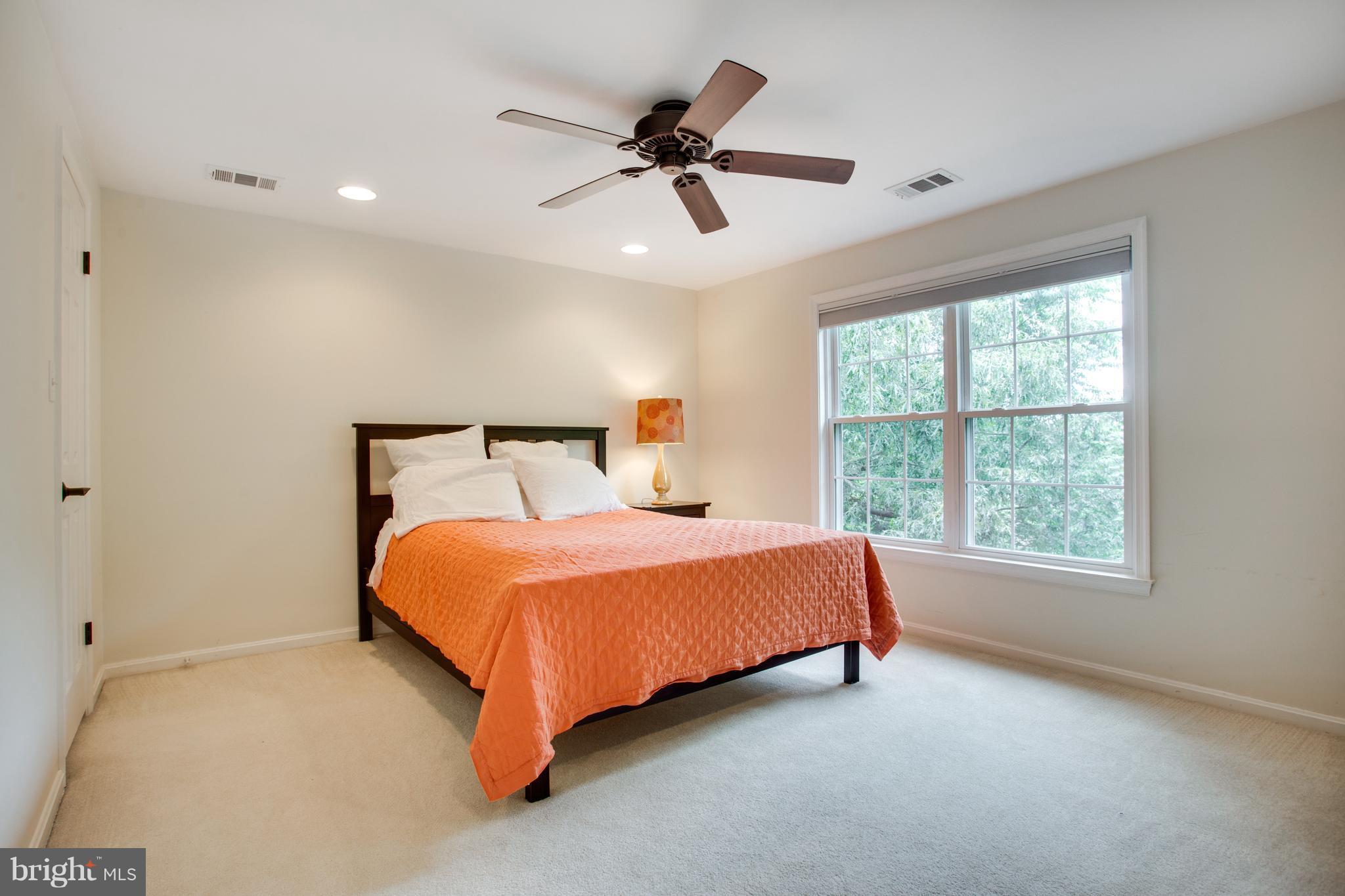 1511 Deer Point Way Reston, VA 20194 - Photo 16 of 30 a bedroom with a bed and window