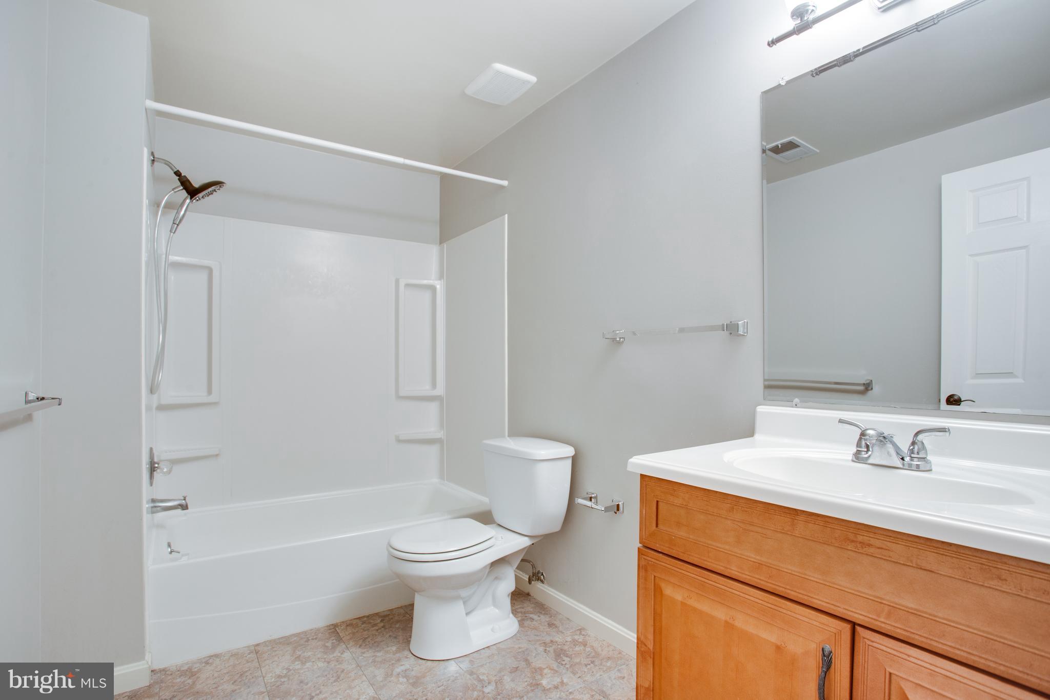 1511 Deer Point Way Reston, VA 20194 - Photo 22 of 30 a bathroom with a sink a toilet and shower