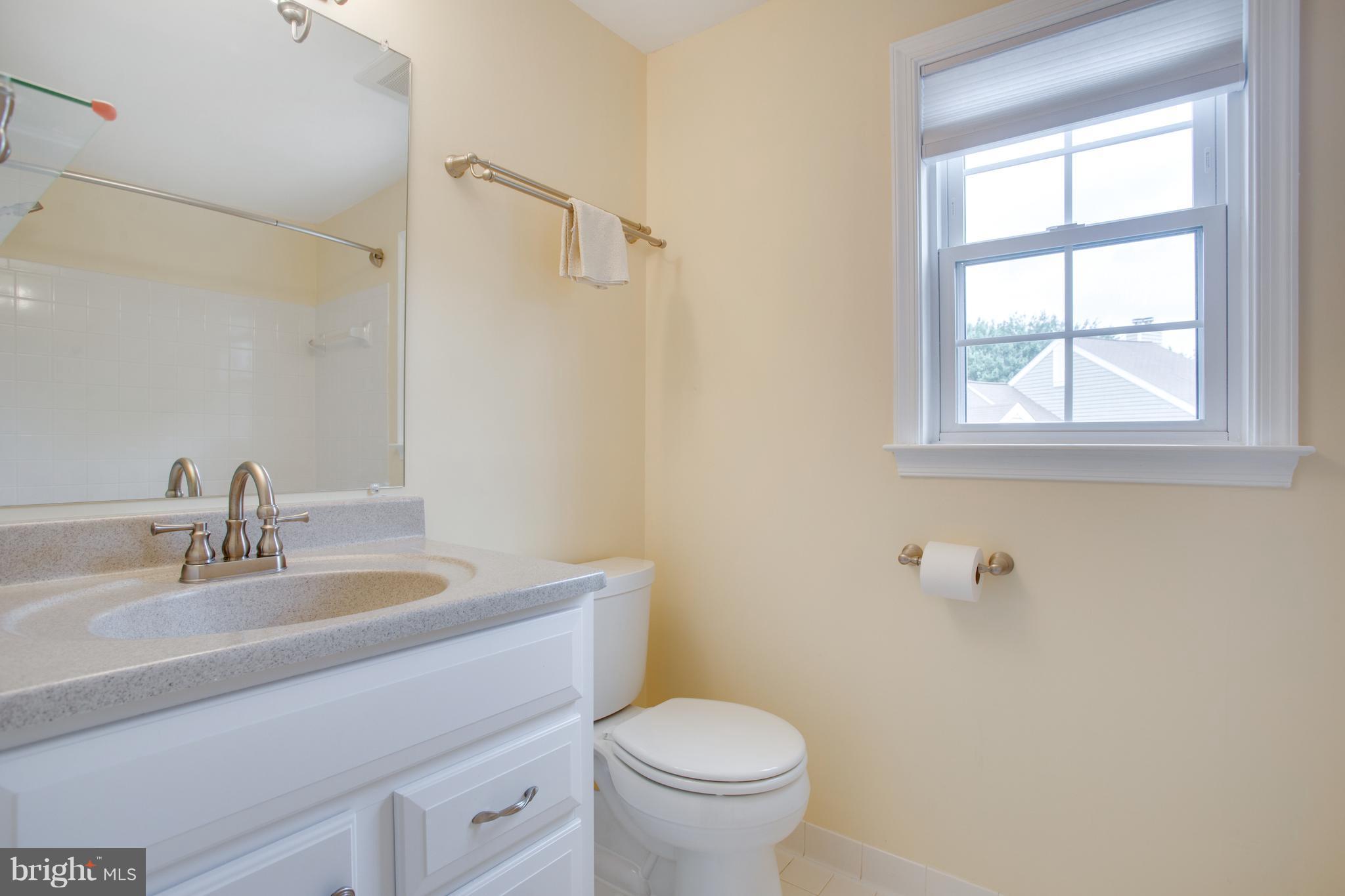 1511 Deer Point Way Reston, VA 20194 - Photo 24 of 30 a bathroom with a sink a toilet and a mirror