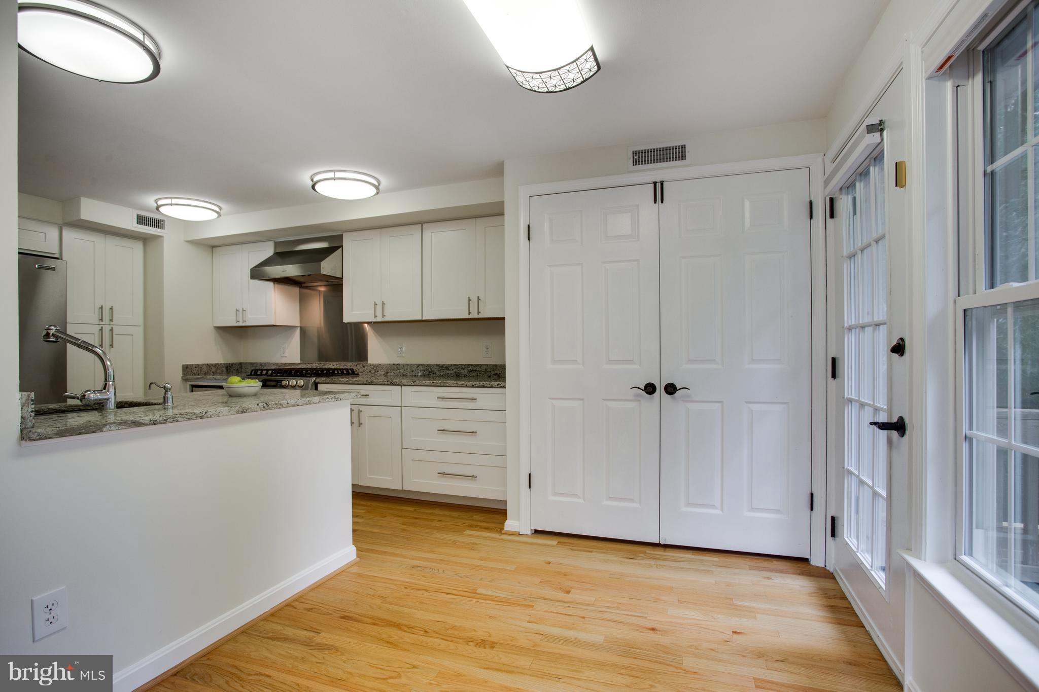 1511 Deer Point Way Reston, VA 20194 - Photo 7 of 30 a kitchen with stainless steel appliances granite countertop a refrigerator and a sink