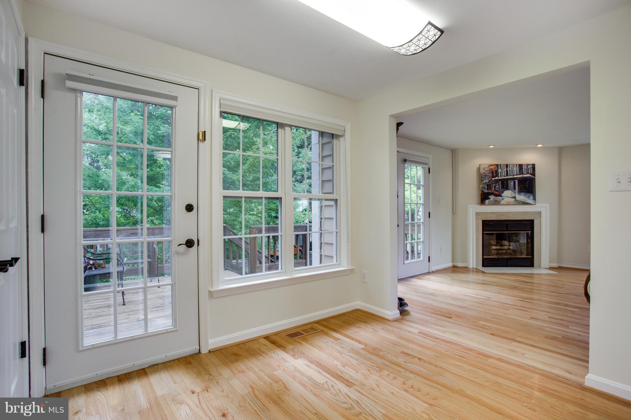 1511 Deer Point Way Reston, VA 20194 - Photo 8 of 30 a view of an empty room with wooden floor and a window