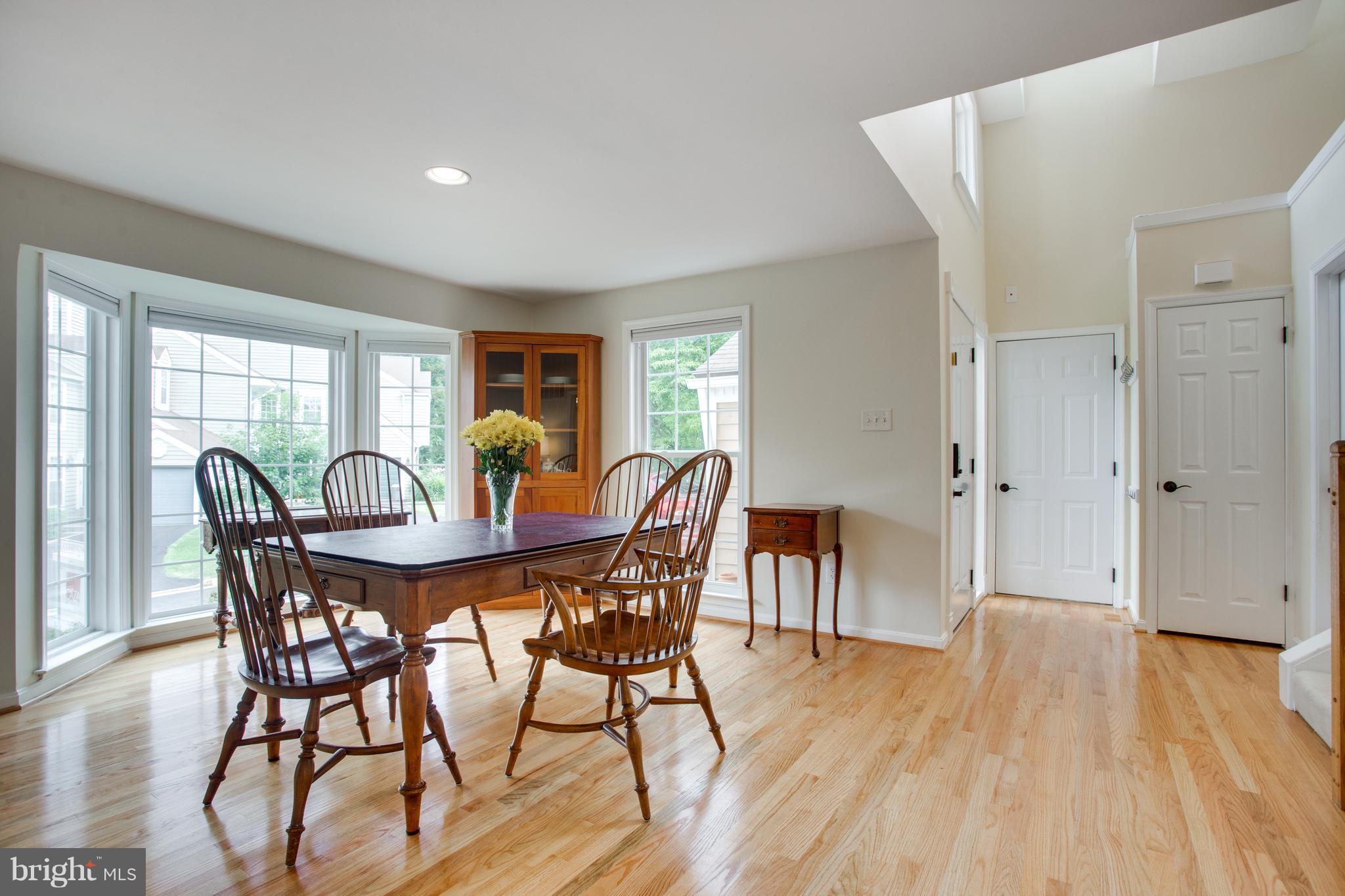 1511 Deer Point Way Reston, VA 20194 - Photo 10 of 30 a view of a dining room with furniture and wooden floor