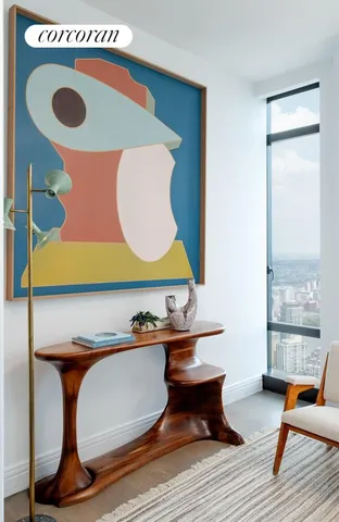a spacious bathroom with a tub sink and mirror
