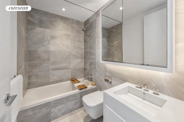 a bedroom with bed and a couch