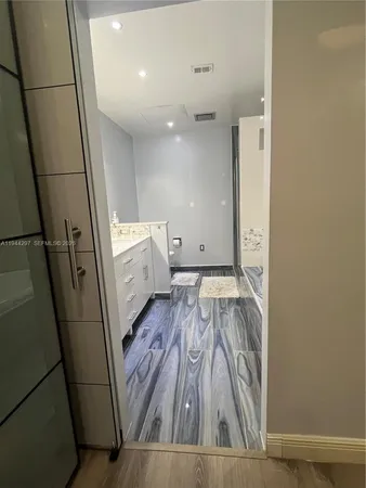 a view of room with wooden floor