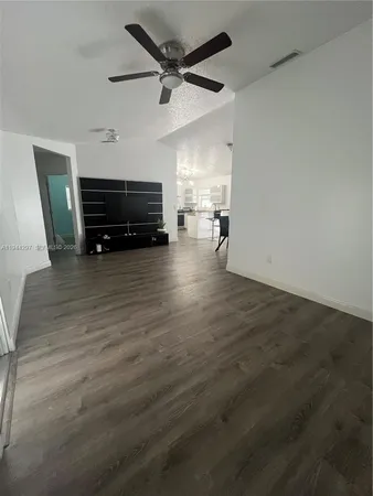 a view of kitchen with furniture and a ceiling fan