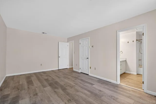 a bathroom with a double vanity sink mirror double and shower