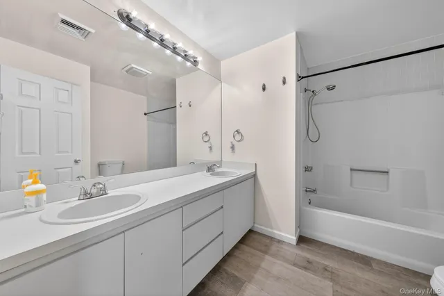 a bedroom with a bed and a table in it