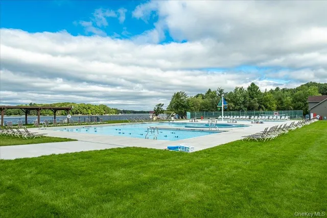 a view of pool table and chairs in patio