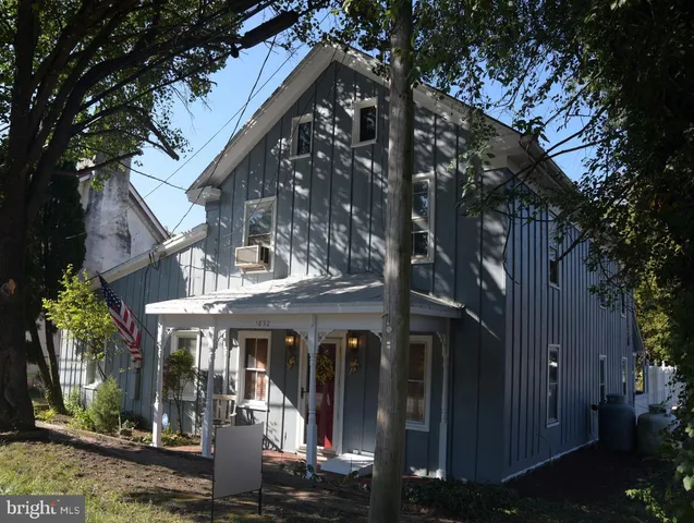 a view of a building with a tree