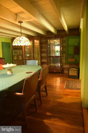 a view of a dining room with furniture and window