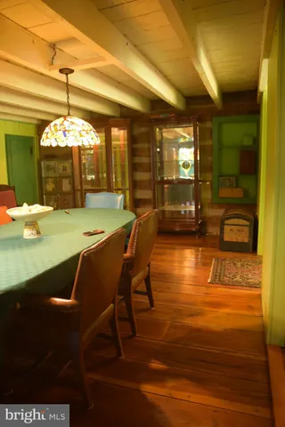a view of a dining room with furniture and window