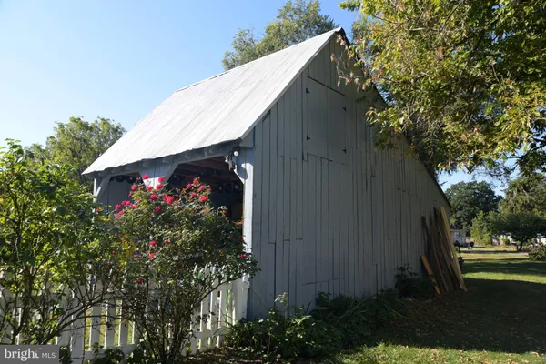 a view of a house and a yard