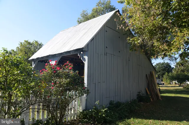 a view of a house and a yard