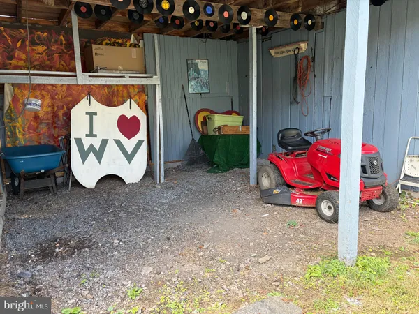 a front view of a house with a garden and trees