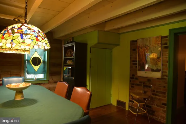 a kitchen with a sink a stove and a mirror