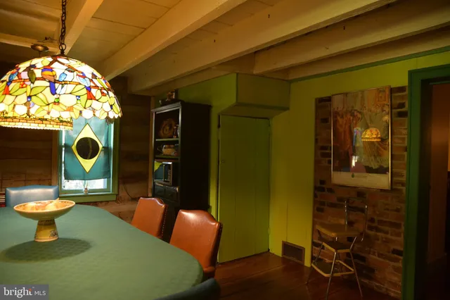 a kitchen with a sink a stove and a mirror