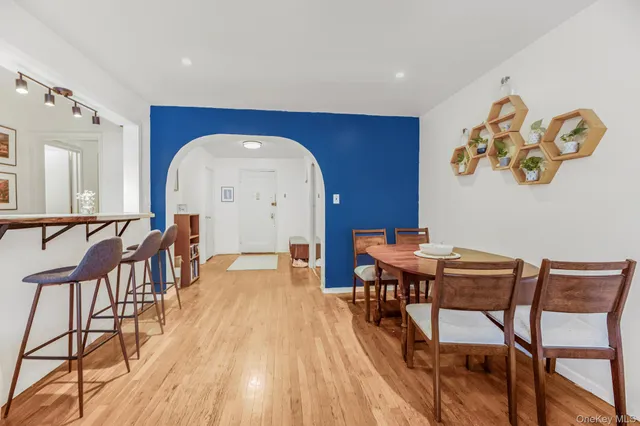a view of a dining room with furniture and wooden floor