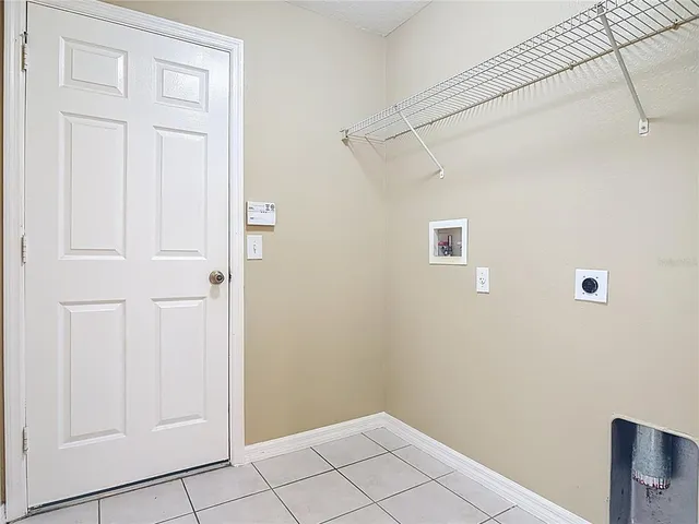 a stove top oven sitting inside of a kitchen