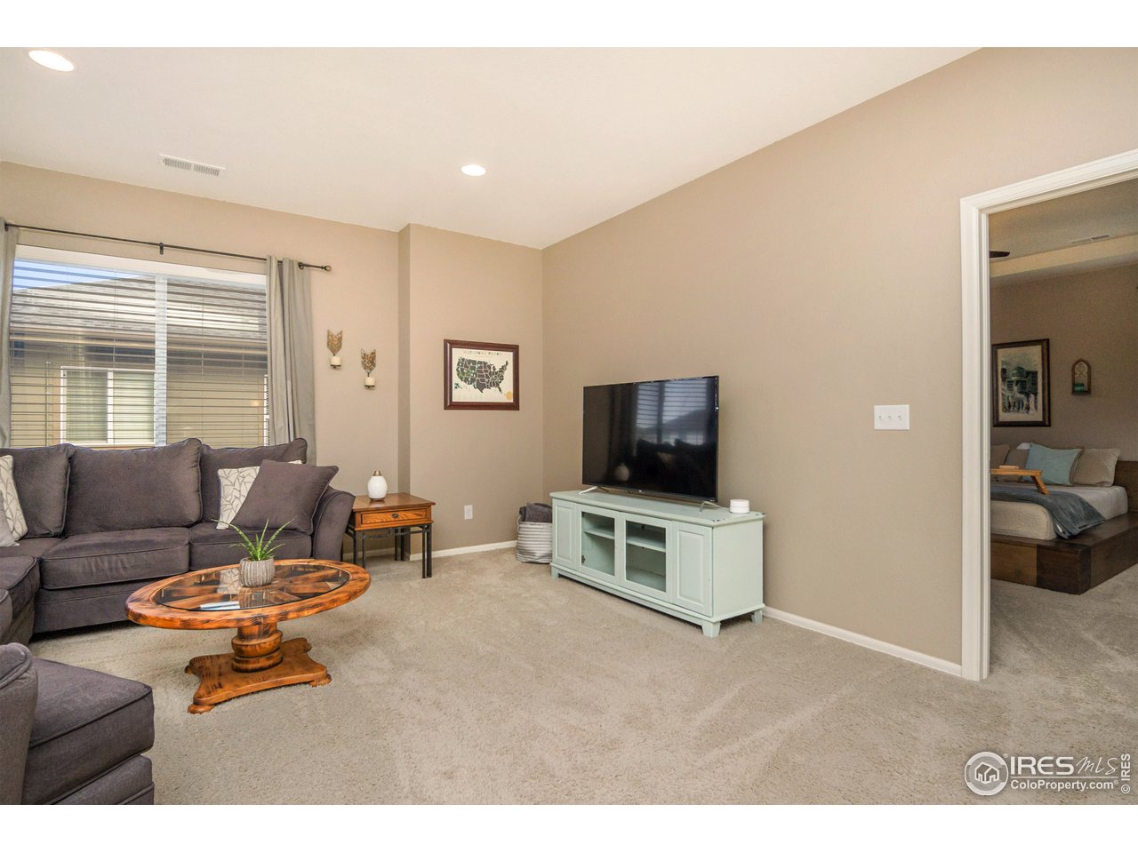 2139 Blue Yonder Way Fort Collins, CO 80525 - Photo 23 of 37 a living room with furniture and a flat screen tv