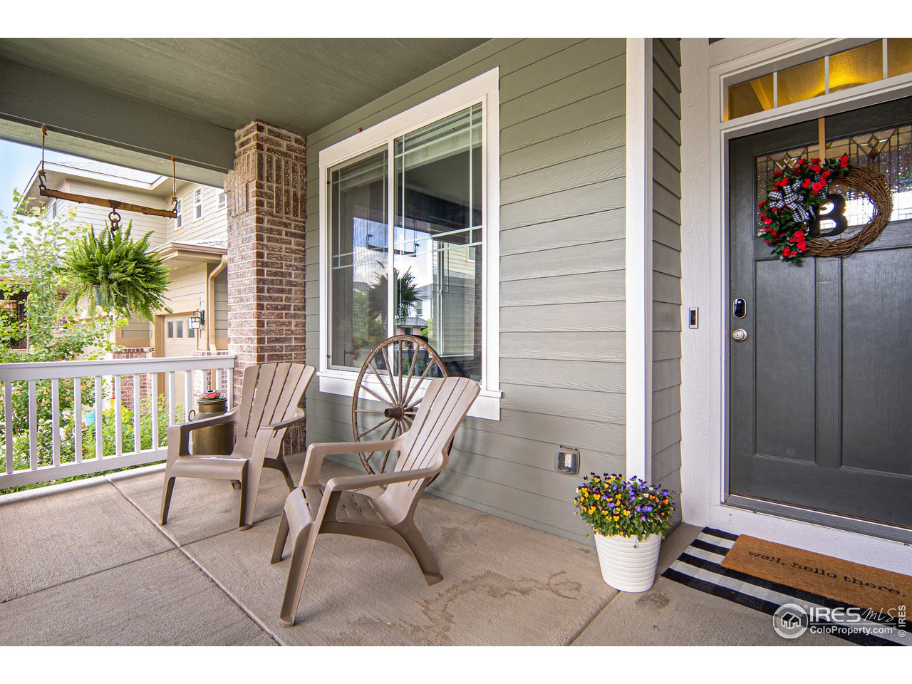 2139 Blue Yonder Way Fort Collins, CO 80525 - Photo 6 of 37 a balcony with chairs and potted plants