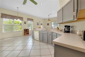 4325 Wordsworth Way Venice, FL 34293 - Photo 11 of 24 a kitchen with a sink a counter top space appliances and cabinets