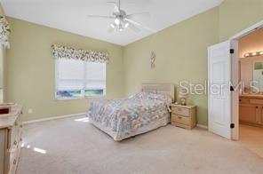 4325 Wordsworth Way Venice, FL 34293 - Photo 14 of 24 a spacious bedroom with a bed and a window