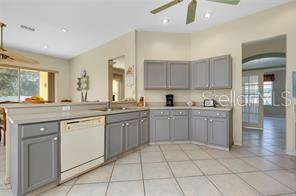 4325 Wordsworth Way Venice, FL 34293 - Photo 10 of 24 a kitchen with a sink window and cabinets