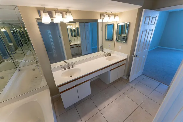 a bathroom with a sink a double vanity and a mirror