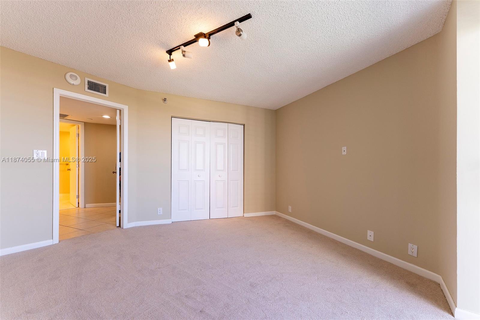 3530 Mystic Pointe Drive, Unit 2207 Aventura, FL 33180 - Photo 15 of 26 a view of an empty room with a window