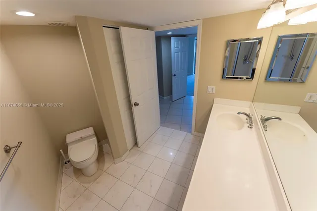 a bathroom with a sink and toilet