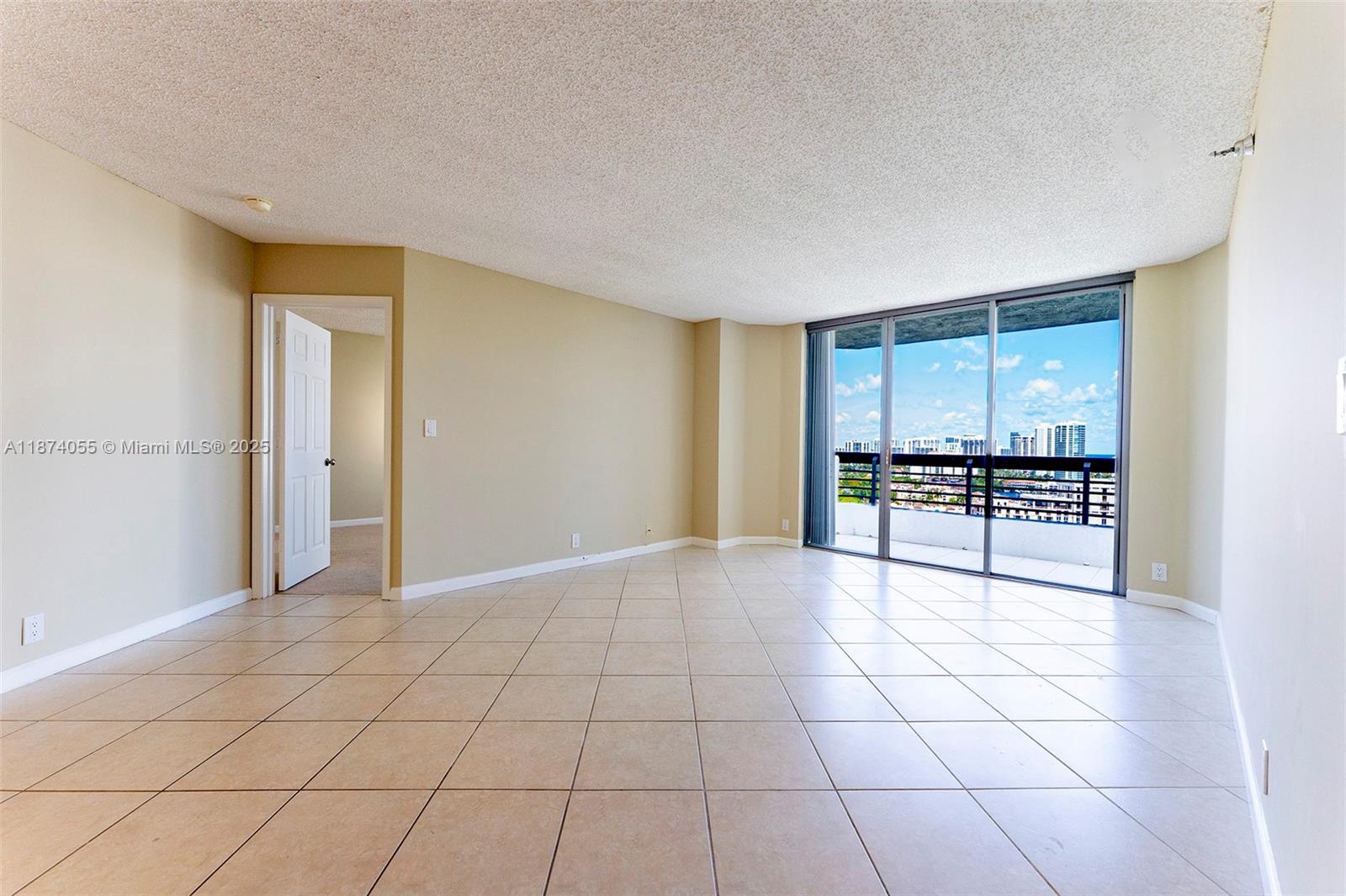 3530 Mystic Pointe Drive, Unit 2207 Aventura, FL 33180 - Photo 2 of 26 a view of a kitchen with a sink and a refrigerator