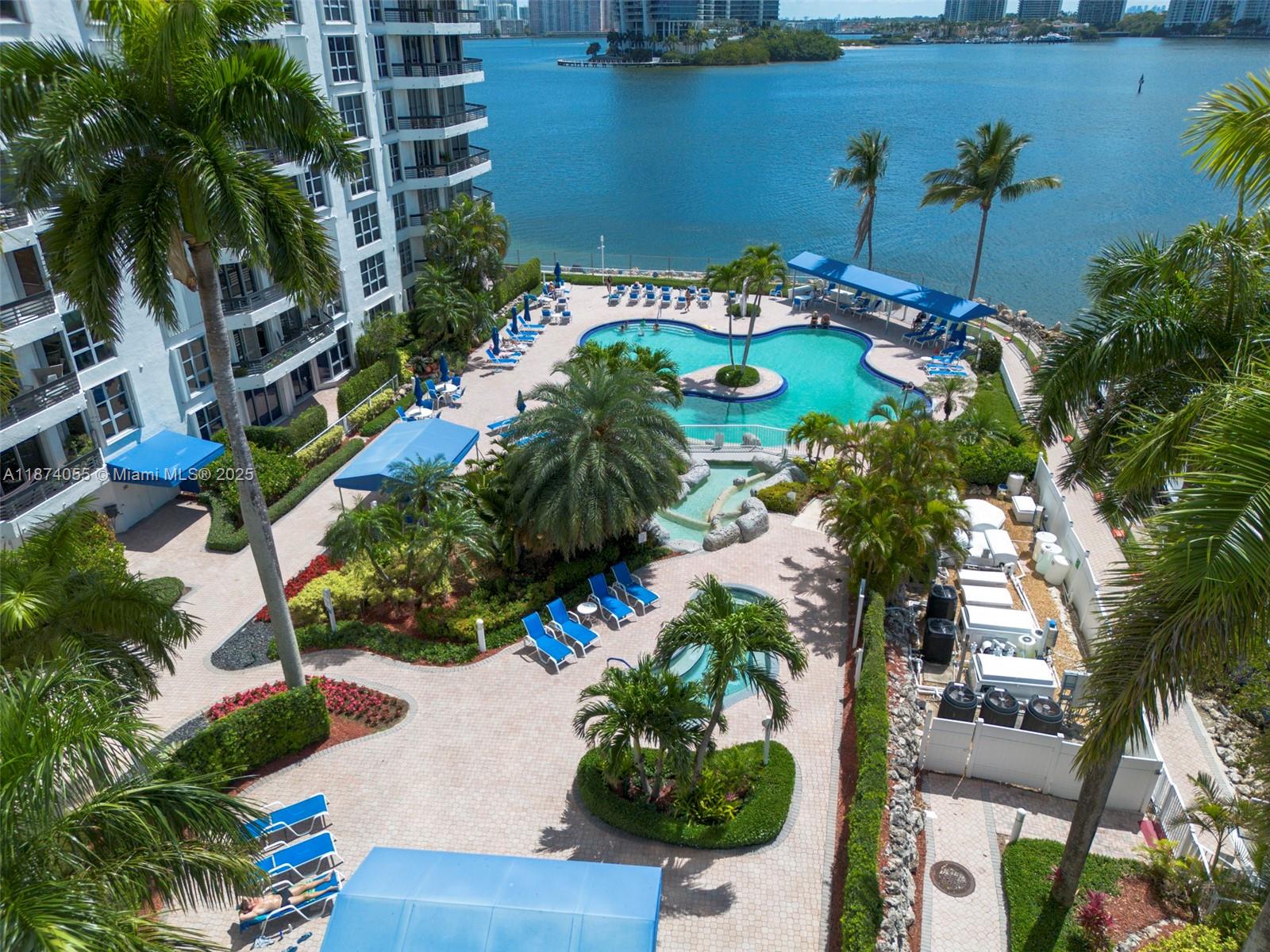 3530 Mystic Pointe Drive, Unit 2207 Aventura, FL 33180 - Photo 21 of 26 a view of swimming pool with outdoor seating
