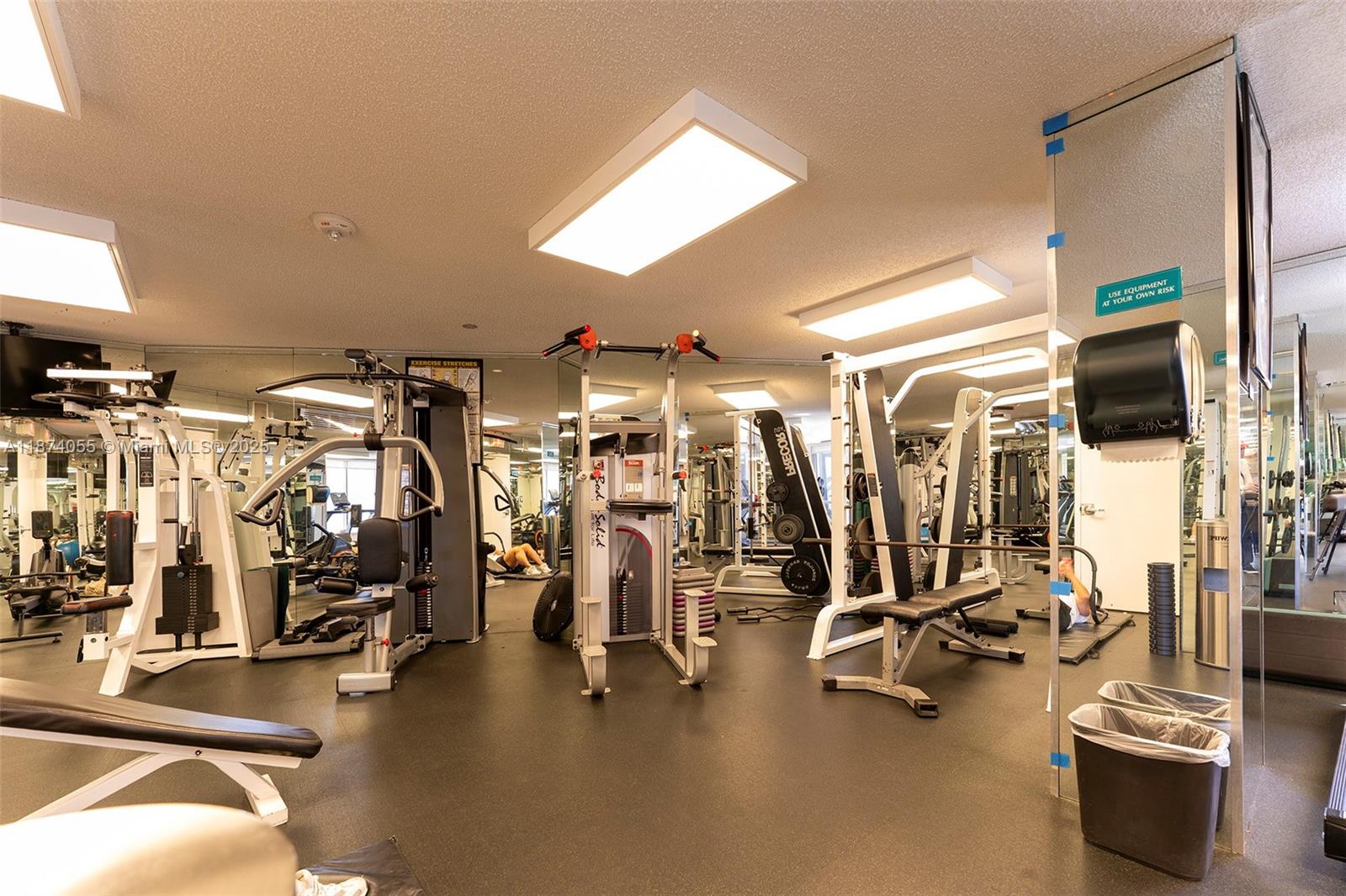 3530 Mystic Pointe Drive, Unit 2207 Aventura, FL 33180 - Photo 22 of 26 a view of a room with gym equipment