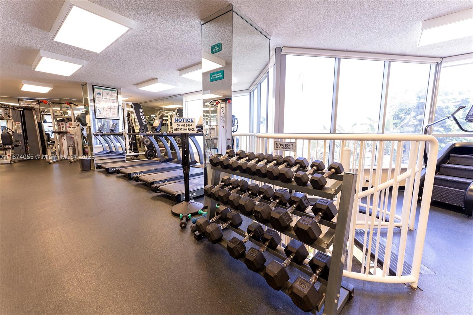 3530 Mystic Pointe Drive, Unit 2207 Aventura, FL 33180 - Photo 23 of 26 a view of a room with gym equipment