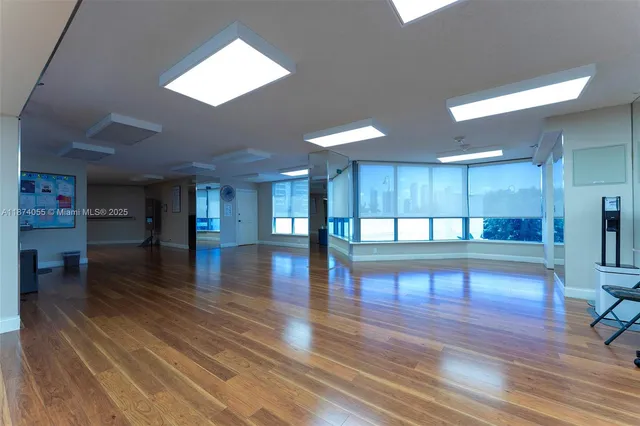 a view of a room with lots of wooden floor