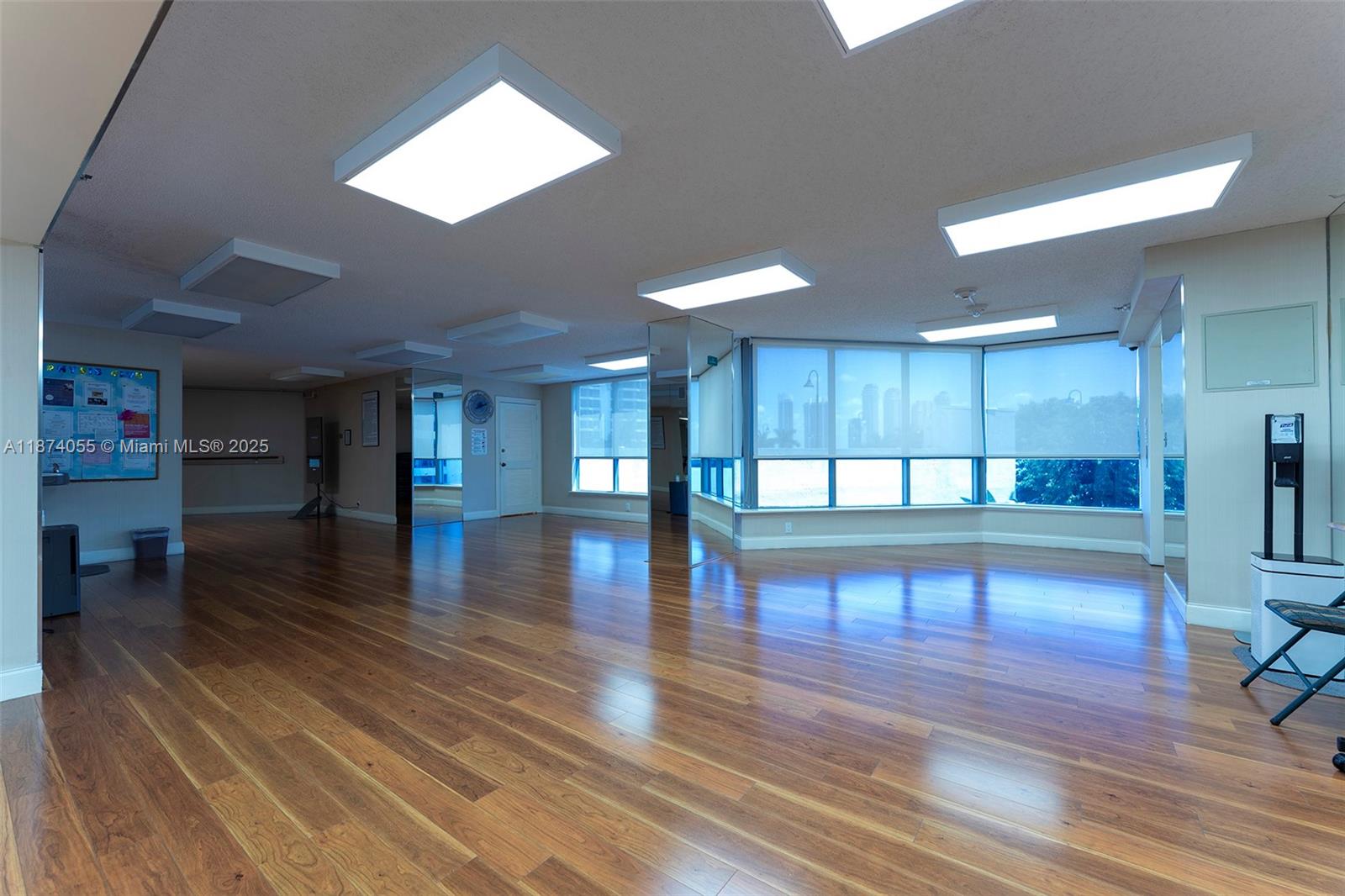 3530 Mystic Pointe Drive, Unit 2207 Aventura, FL 33180 - Photo 24 of 26 a view of a room with lots of wooden floor