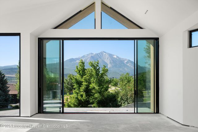 a view of a door and a window