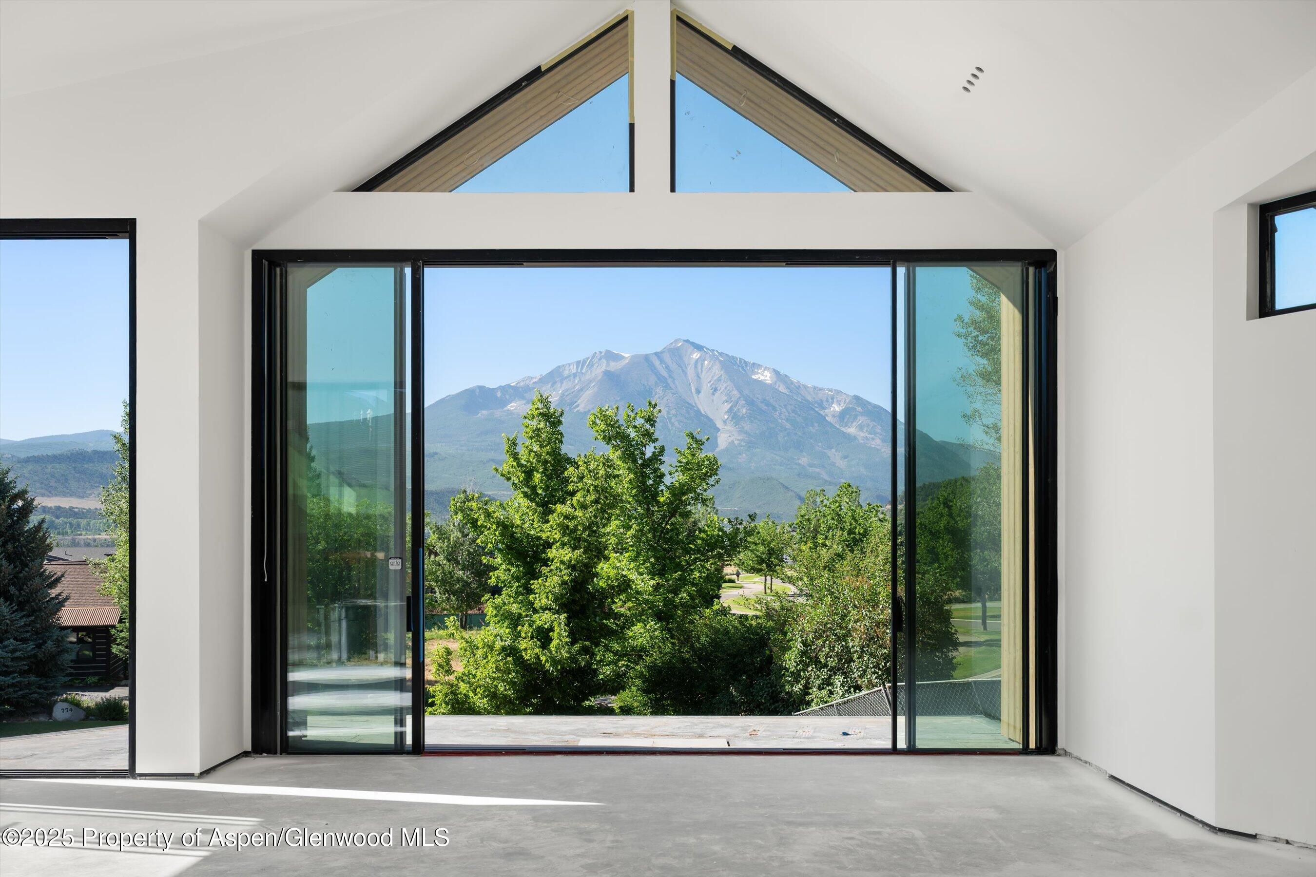 a view of a door and a window