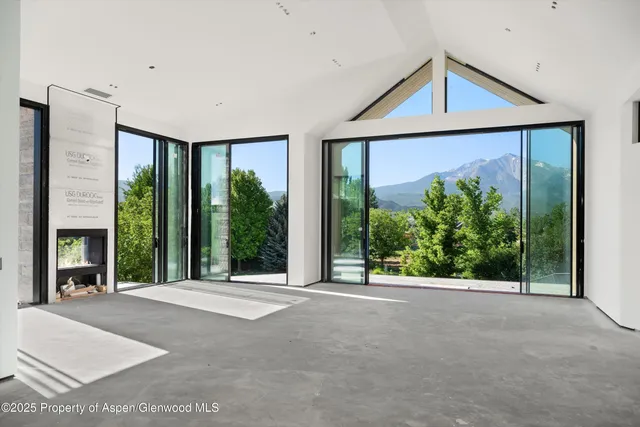 a view of a porch with a floor to ceiling window and yard