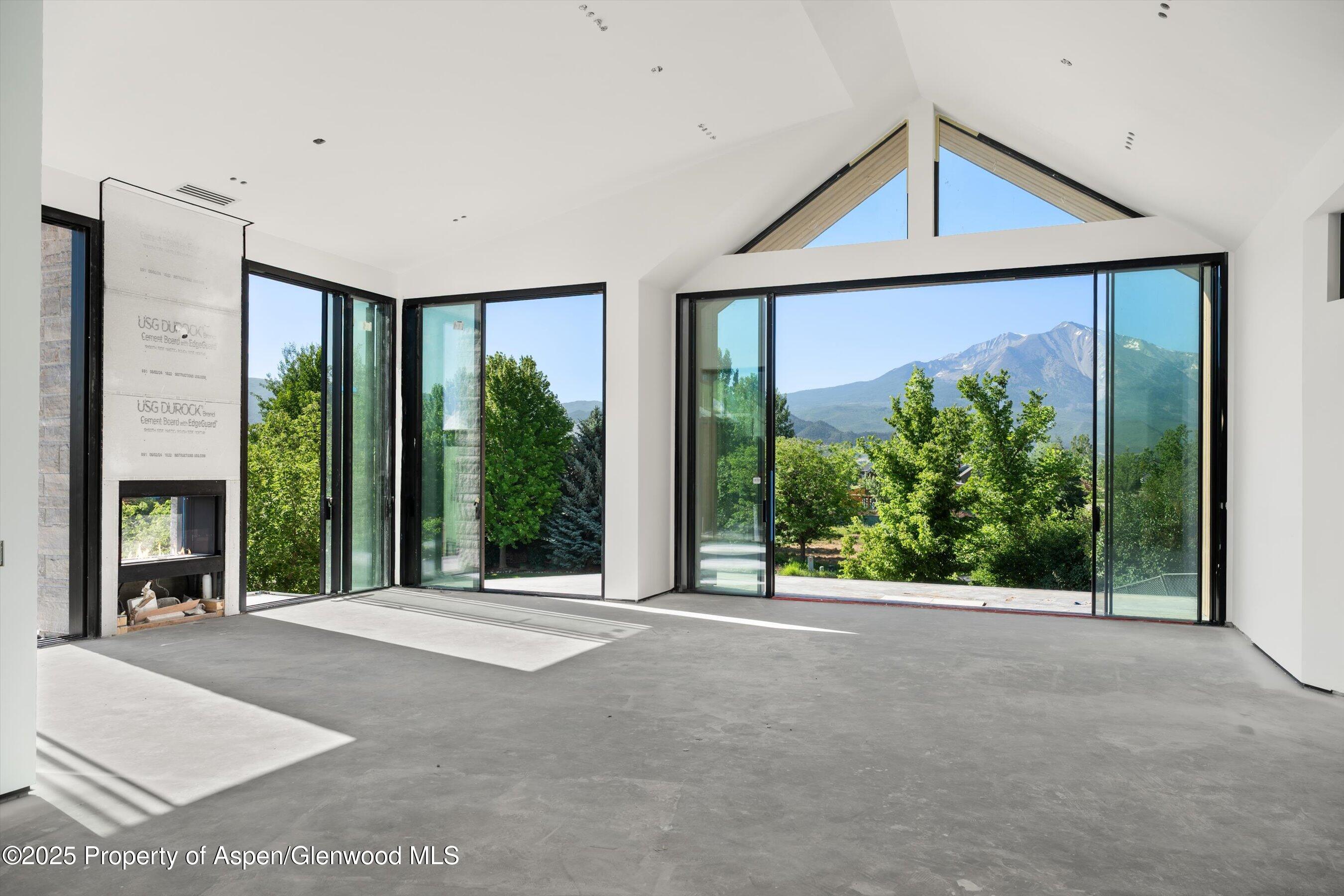 769 Perry Ridge Carbondale, CO 81623 - Photo 2 of 36 a view of a porch with a floor to ceiling window and yard