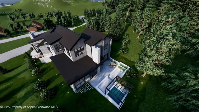 an aerial view of a house with a yard