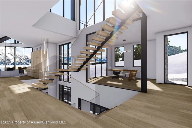 a living room with furniture and stairs