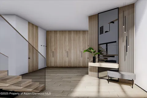 a view of an entryway with wooden floor