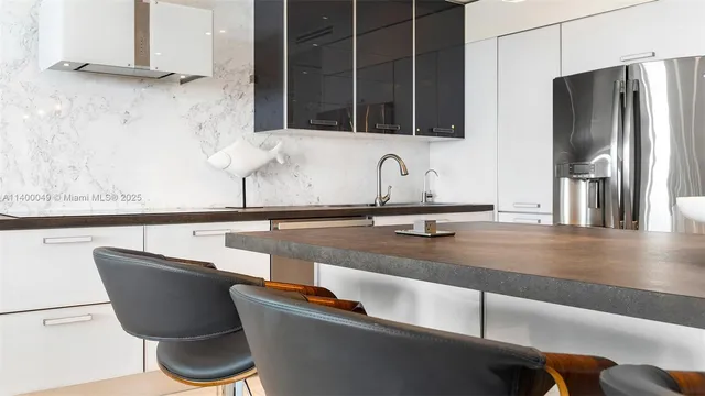 a view of a hallway with closet and a rug