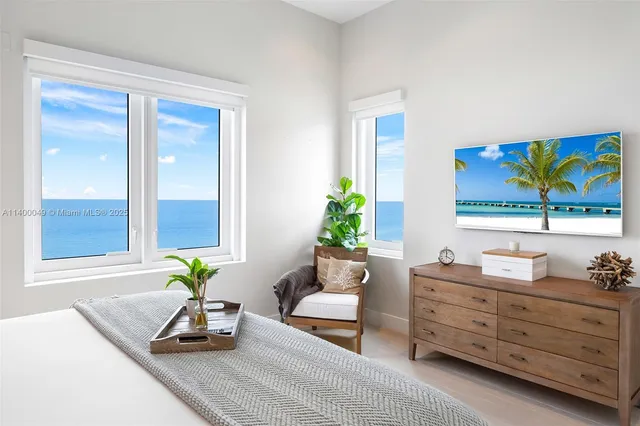 a living room with furniture and painting on the wall